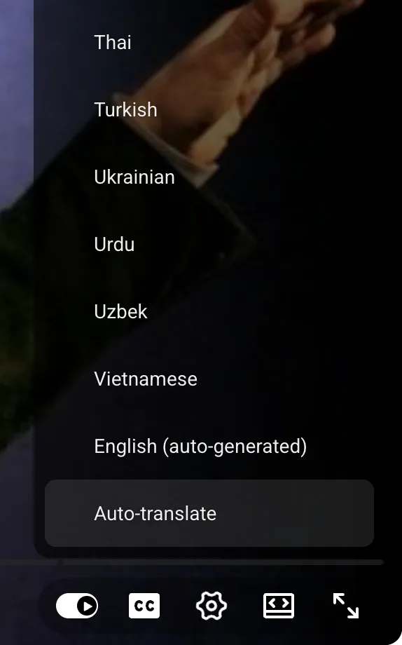 YouTube player Subtitles/CC menu listing caption languages, ending with English (auto-generated) and Auto-translate